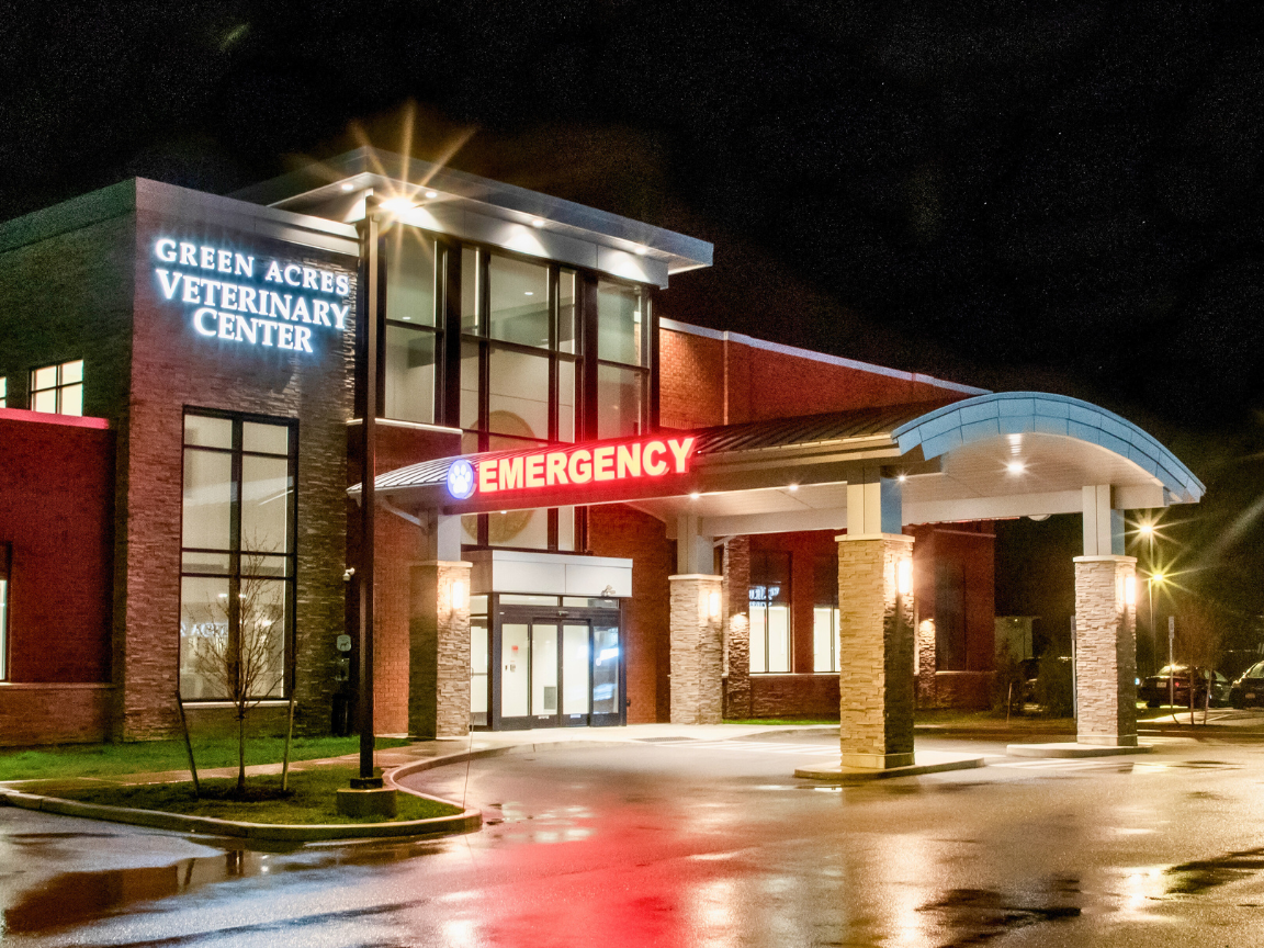 Photo of the outside of Green Acres Veterinary Center at night